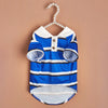 A blue and white striped polo shirt for a small dog displayed against a neutral background.