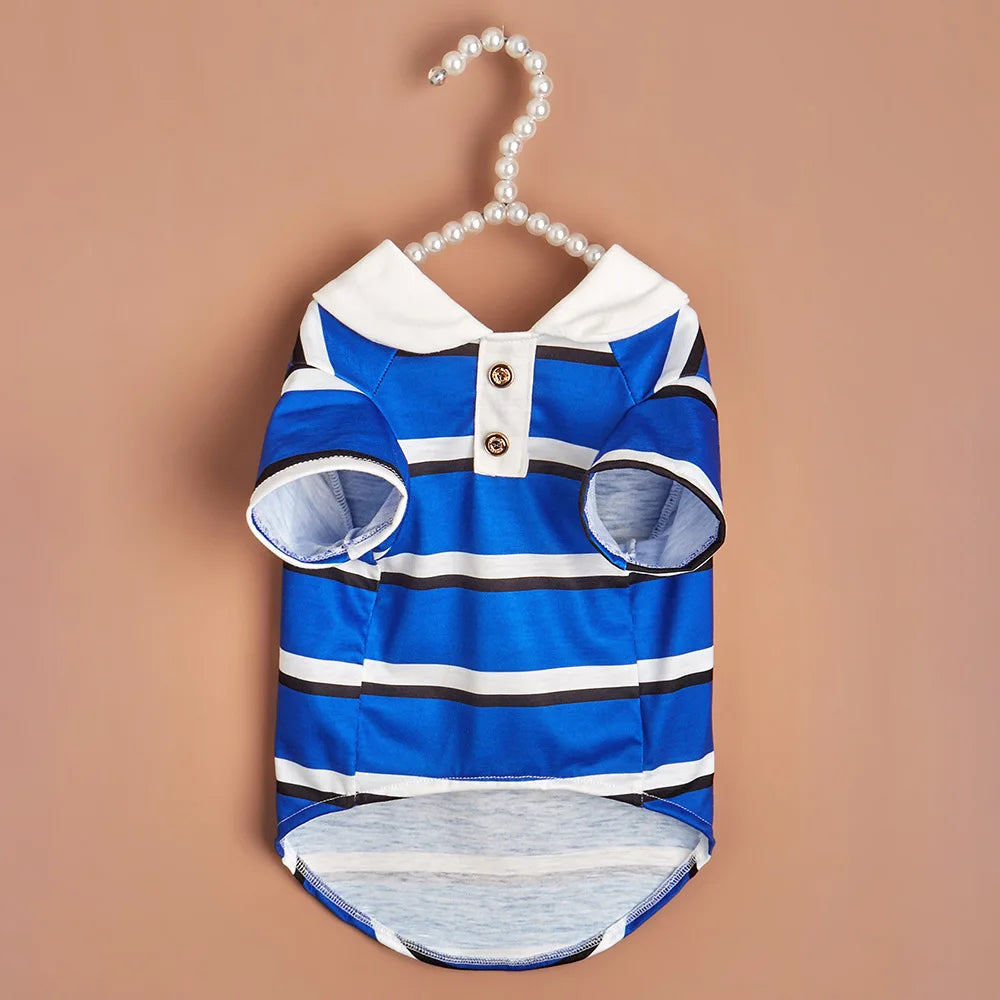 A blue and white striped polo shirt for a small dog displayed against a neutral background.