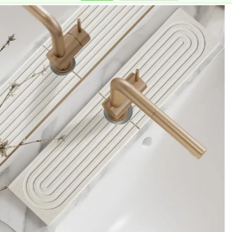 A brass diatomaceous earth absorbent mat is installed on a white countertop, featuring a ribbed design.