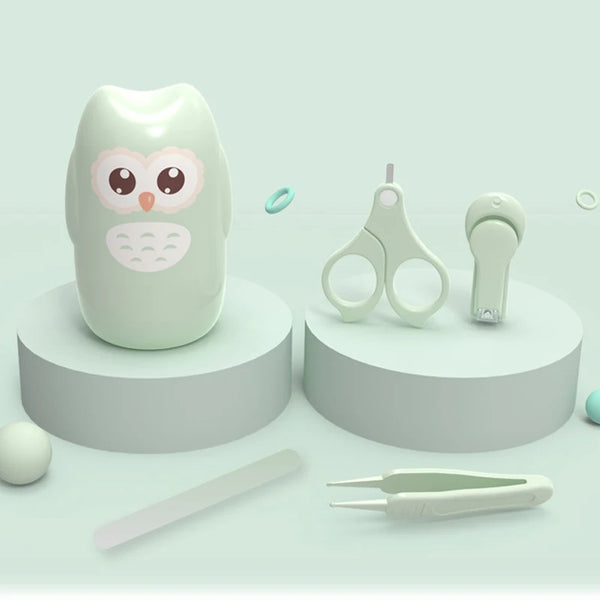 A set of kid-safe stainless steel nail care tools including a shaped nail and various grooming instruments.