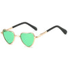 Funny heart-shaped pet sunglasses with green lenses and gold-toned frames