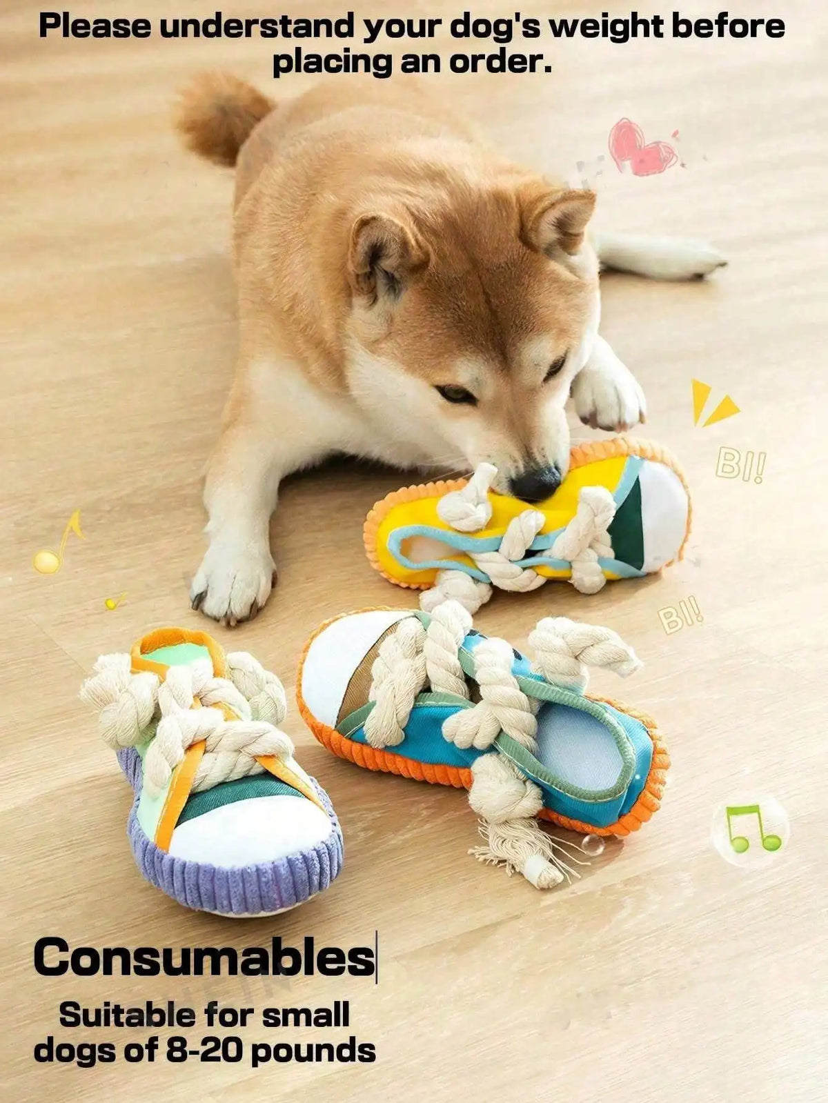A fluffy dog is lying down next to a pair of squeaky slipper dog chew toys with rope.