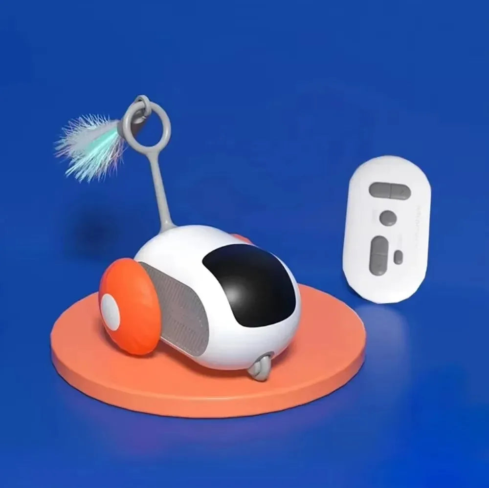 A white interactive automatic pet toy car is shown on an orange base with a blue feather accessory.