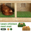 A brown hen is resting in a wooden nesting box lined with green lawn chicken nest mats.