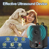 A woman is interacting with a dog while holding an effective ultrasound device for pet deterrence.