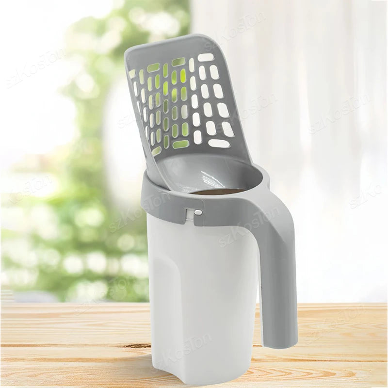 A gray heavy duty cat litter shovel with a mesh top and a white plastic refill bag is shown on a wooden surface.