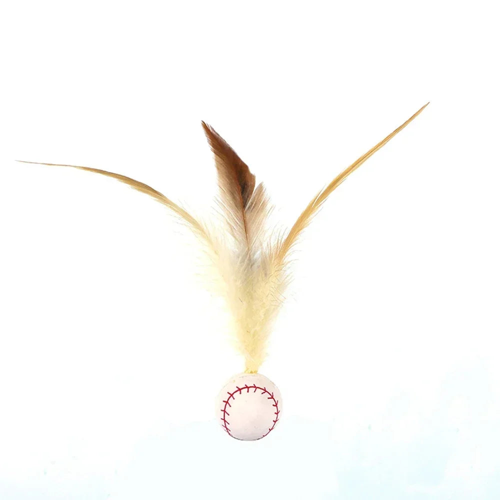 A brown and tan feather attached to a baseball, used as an interactive cat ball for hunting fun.