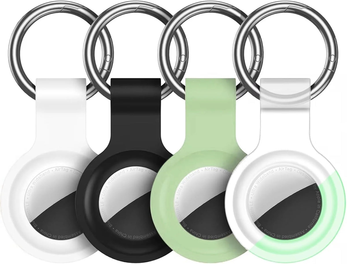 Silicone AirTag protective cover with keychain in various colors including white, black, and green.