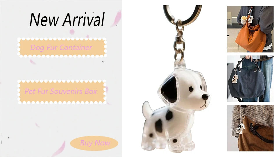 A clear, dog-shaped keychain featuring a white and black spotted design, attached to a silver chain.