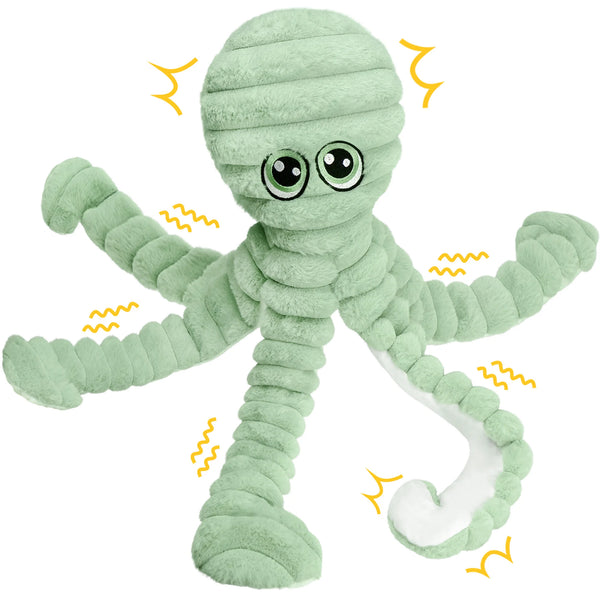 A soft, light green stuffed octopus toy with grinding teeth and squeaker features.