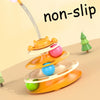 An orange interactive cat toy tower with multiple rotating platforms and colorful balls, designed to be non-slip.