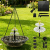 A solar-powered hanging bird bath fountain with a glass bowl suspended by chains in a grassy garden.