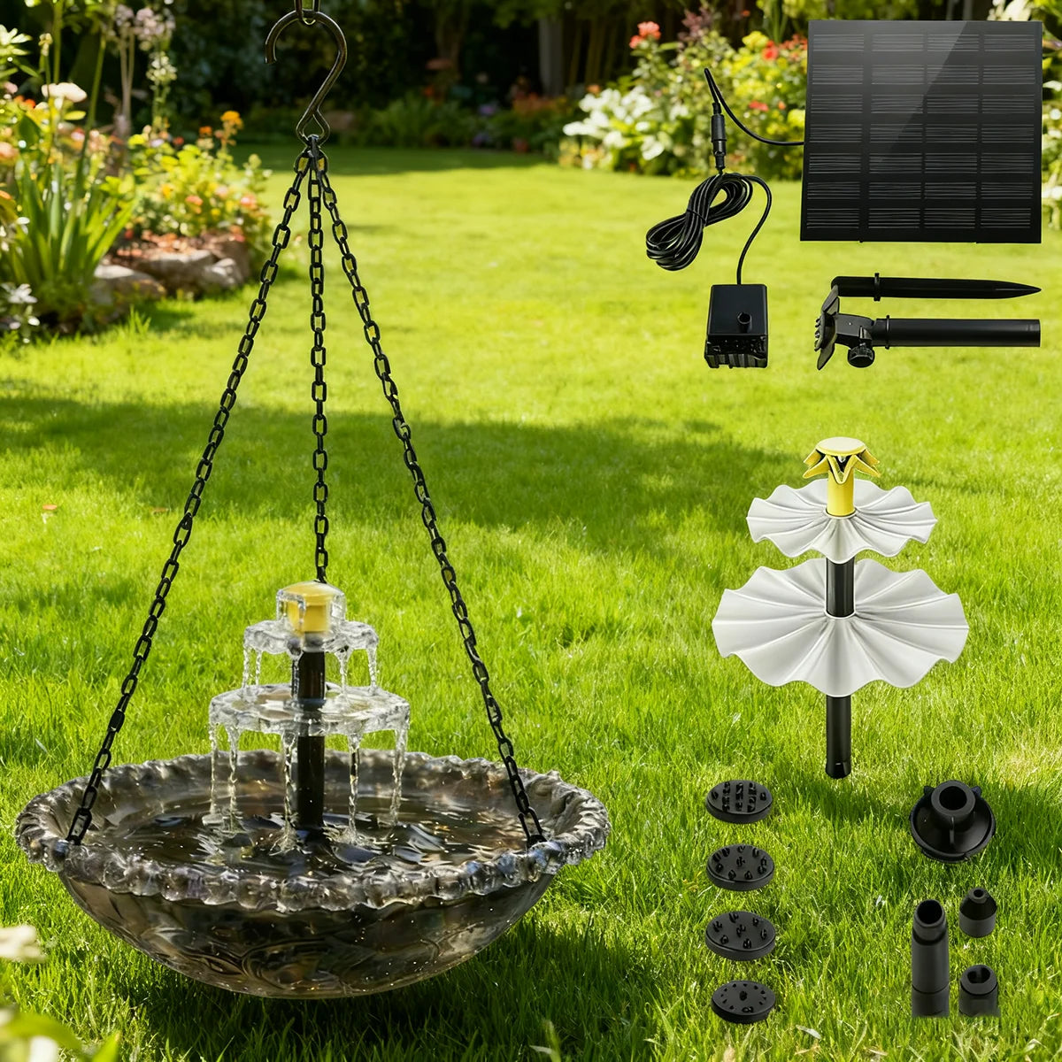 A solar-powered hanging bird bath fountain with a glass bowl suspended by chains in a grassy garden.