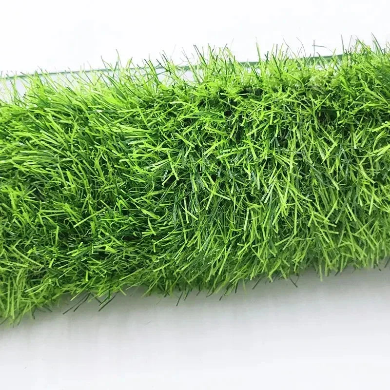 A dense mat of bright green artificial grass used for dog training.