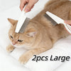 A cat is being groomed with a white multi-functional pet grooming comb and brush set.