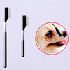 A black pet face comb for dogs and cats is shown next to a close-up of its use on a dog's face.