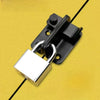 A black sliding bolt lock is mounted on a yellow surface.