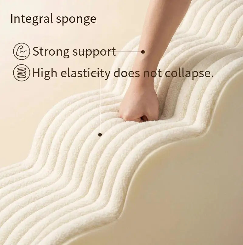 A hand is pressing into a flexible, white integral sponge product designed for strong support and high elasticity.