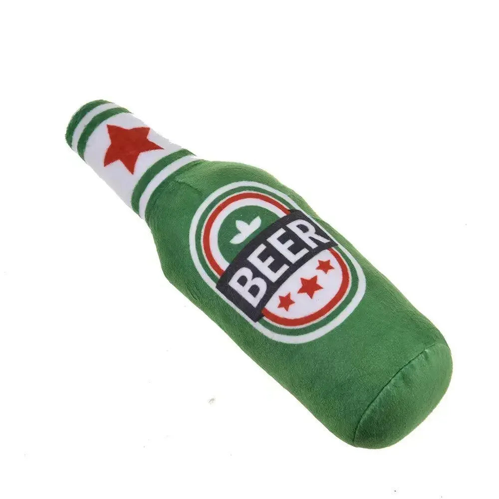 Green plush beer bottle dog toy with a red star detail
