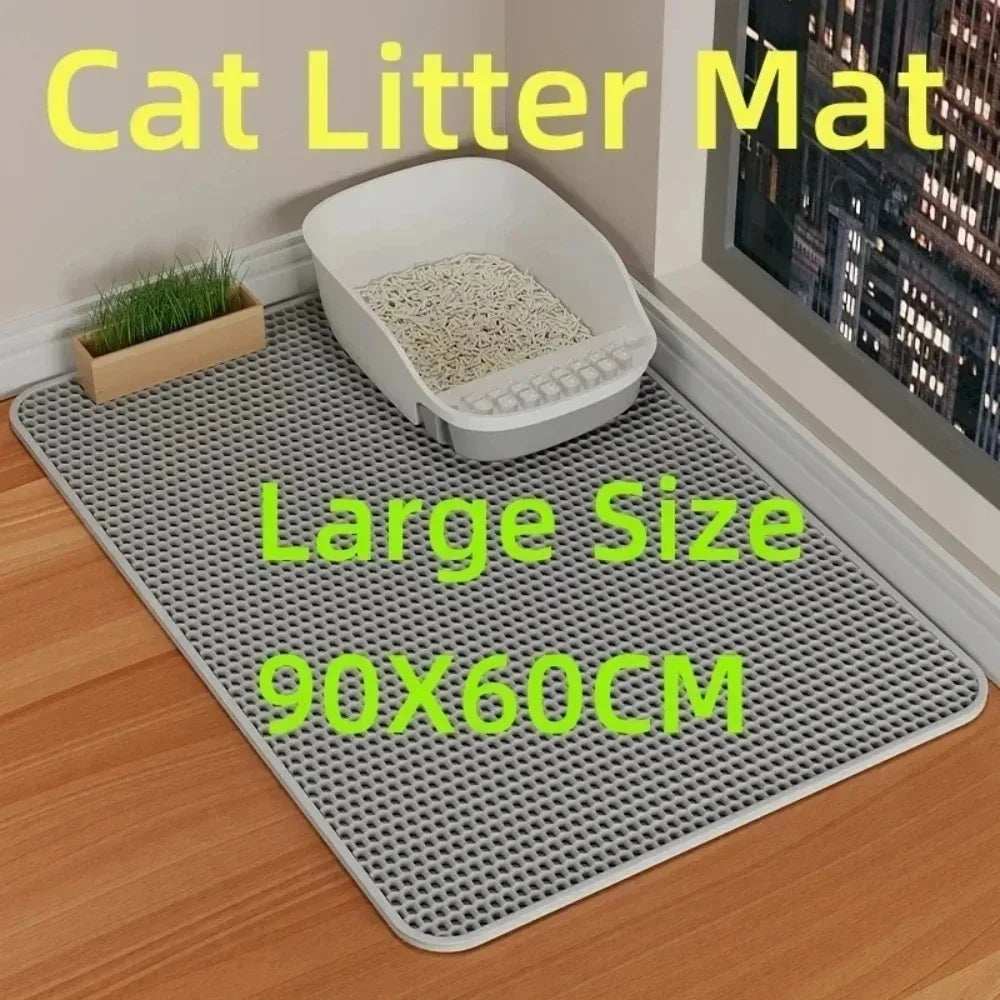 A large gray cat litter mat with a removable tray is shown on a wooden floor.