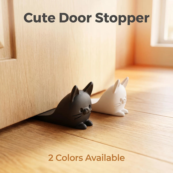 A black and white cat door stopper wedge sitting on a wooden floor next to a door frame.