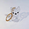 Klares Glaspuppy-Anhänger mit goldfarbenen Ohrmarken und einem goldenen Ring.