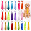 A collection of adjustable pet bow ties in various colors and fabrics for dogs and cats.