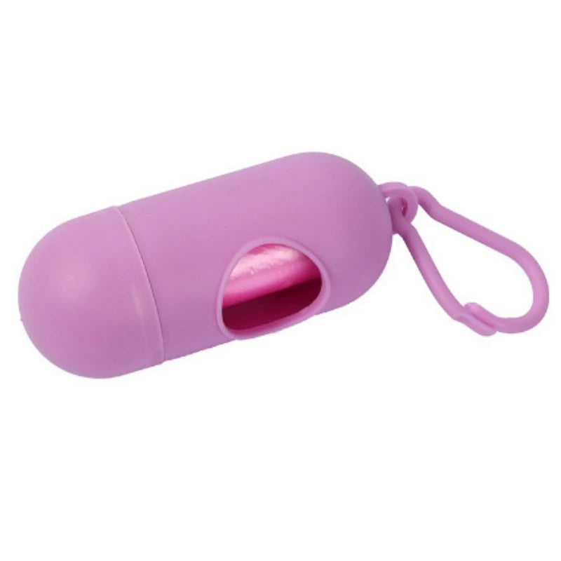 A pink capsule-shaped dog poop bag dispenser with a carabiner clip.