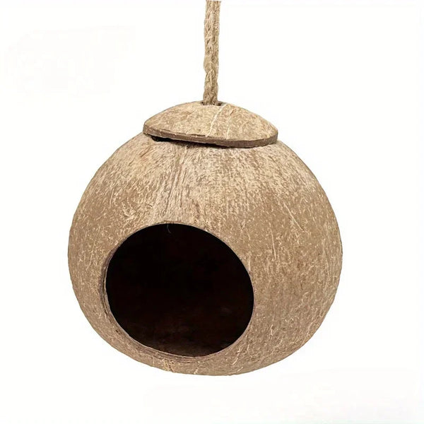 A natural coconut shell bird nest house with a circular entrance and a hanging lanyard.
