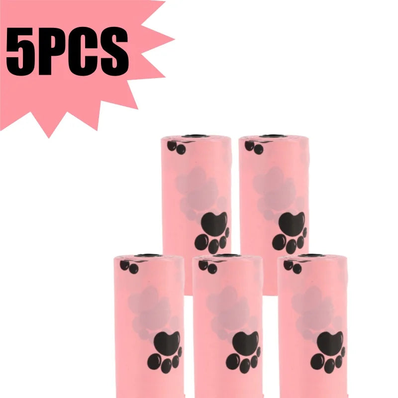 Five pink biodegradable dog waste bags with black paw prints shown in a vertical arrangement.