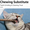 A tabby cat is aggressively chewing a natural herbal cat chew stick.