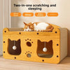 A wooden cat scratching and sleeping house with two paw-shaped openings and a cat resting inside.
