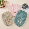 A pink knitted fleece pullover sweatshirt for pets is displayed next to a grey and teal version.