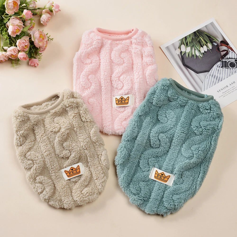 A pink knitted fleece pullover sweatshirt for pets is displayed next to a grey and teal version.