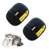 A pair of black reusable electrostatic pet hair remover gloves with yellow accents resting next to a cat and a dog.
