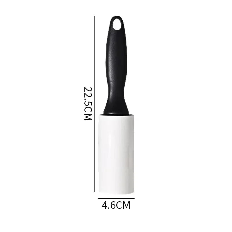 A white adhesive lint roller with a black handle, shown against a white background.