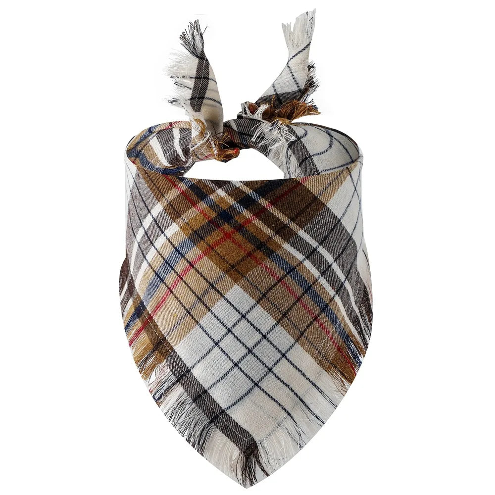 A plaid dog bandana featuring brown, tan, blue, and white checks with fringed ties.