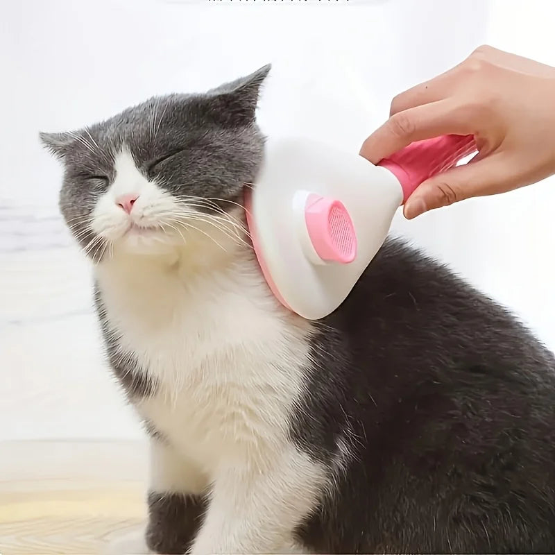 Eine schwarz-weiße Katze wird mit einem rosa Haustier-Grooming-Gerät gepflegt.