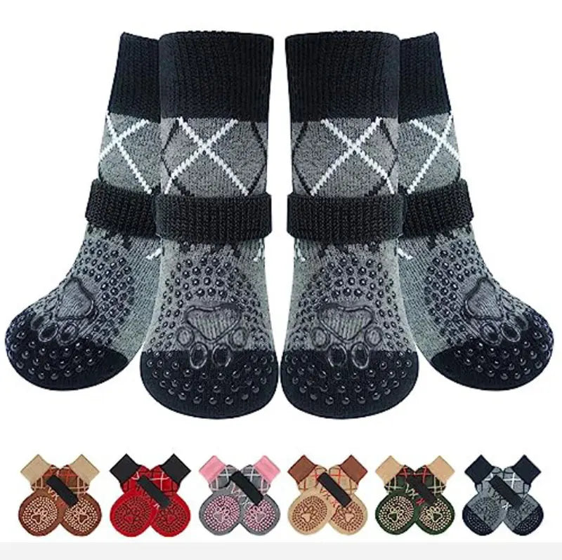 A pack of four anti-slip dog traction socks in black and gray patterns.