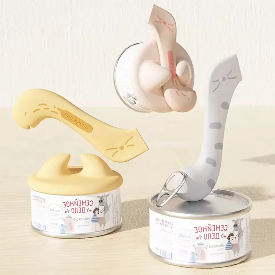 A silicone pet can opener and feeding spoon with a sealing lid shown next to its components.