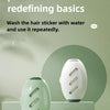 A white, oval-shaped silicone roller for pet hair removal is displayed on a light green surface.