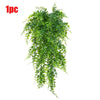 A bundle of artificial green Persian fern hanging vines.