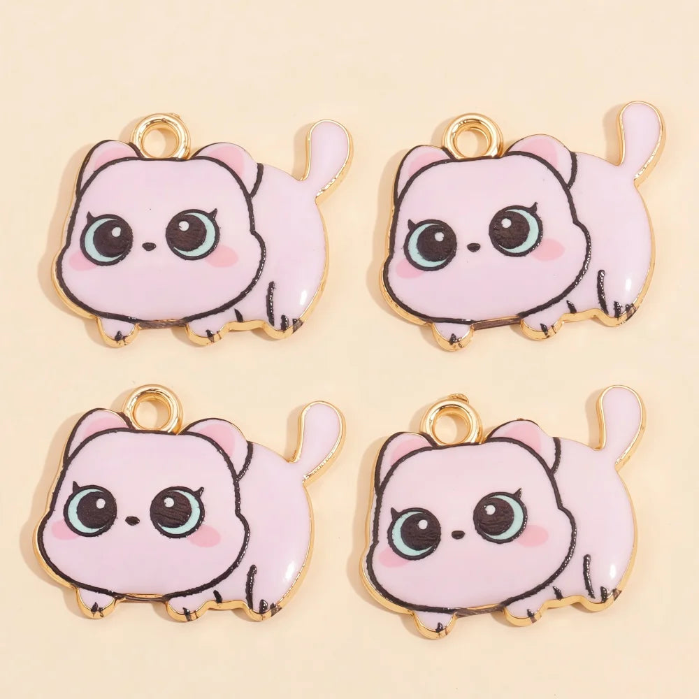 Four pink cat pendant charms with gold-colored jump rings and light blue accents.
