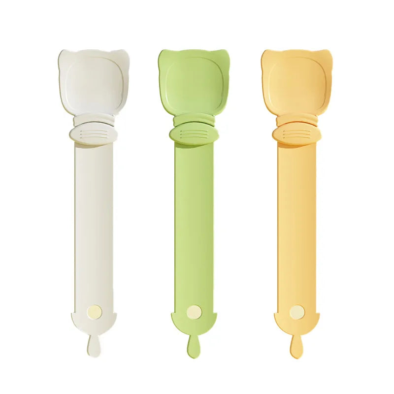 Three long-handled pet food dispensing spoons in white, light green, and yellow.