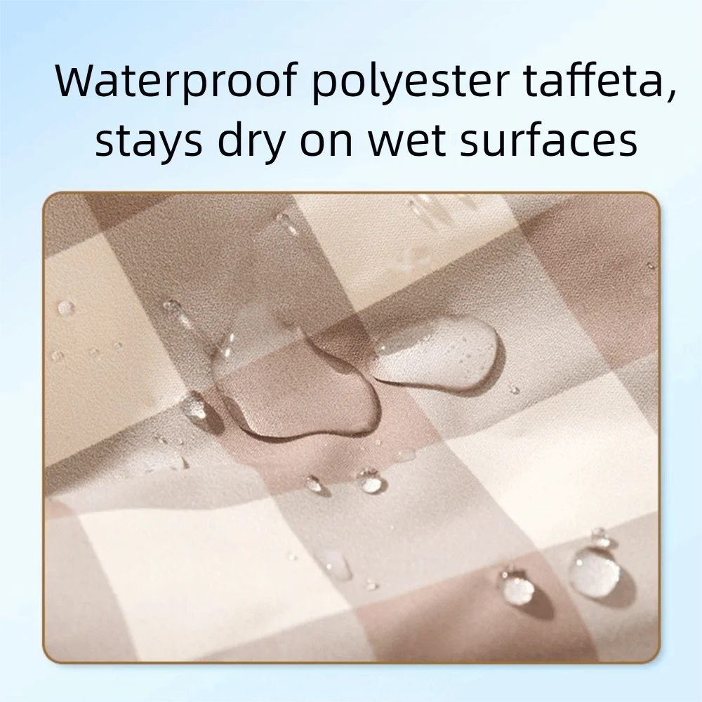 Close-up of waterproof polyester taffeta fabric with water droplets on a checkered pattern.