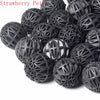 A pile of black, spherical bio balls used for aquarium water filtration.
