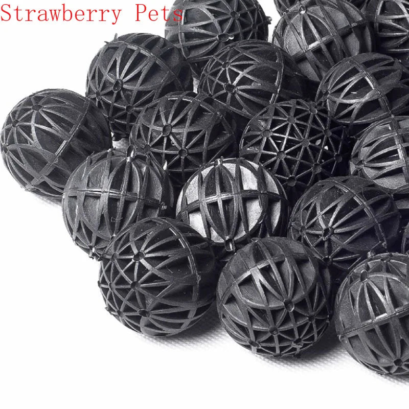 A pile of black, spherical bio balls used for aquarium water filtration.
