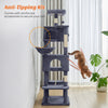 A multi-level gray cat climbing tree with reinforced accessories and sisal scratching posts shown next to a cat.