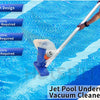 A hand is operating a silver pole with an underwater vacuum cleaner jet cleaning the bottom of a swimming pool.