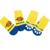 A pack of four yellow and blue anti-slip pet socks for dog and cat protection.